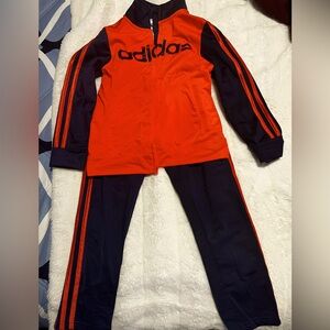 Like a new.Two set jacket and pants : orange and blue - black,white and red